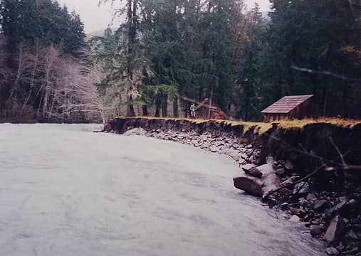 Elkhorn hiker's shelter and horse barn before being moved January 1994 Elwha River K. Tanner