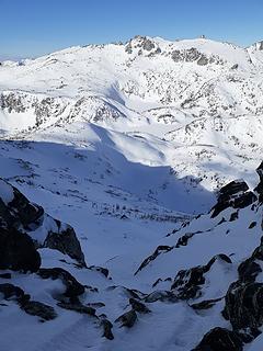 Looking down the north face, with Enchantment Peak in the background