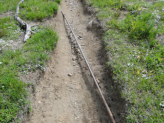 Metal pipe on trail in Glacier Basin.