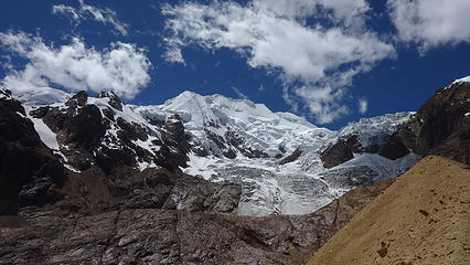 Looking up at the false summit of Illimani