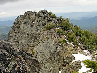 An extended ridge with the marked summit as the far highpoint.