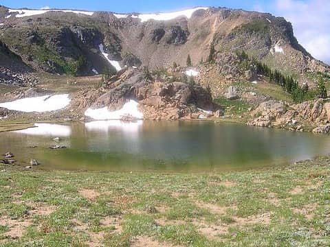 "Windy Lake", the point directly over the lake is the high point due north of Windy Pass.