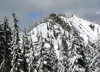 Looking back at the adventure; further rock is the south summit; back side of nearer rock is the crux.