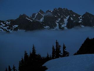 Nighttime clouds in the Goodell Creek basin and a star over the Pickets