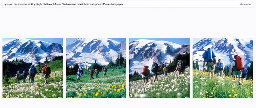 group of backpackers walking single file through flower filled meadow mt rainier in background 35mm photography