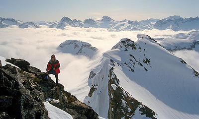 Matt at eastern summit.  With middle of Ptarmigan Traverse behind.