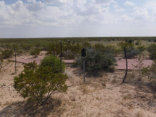 Concrete arrow at old site of Hudspeth Intermediate Field along HW62