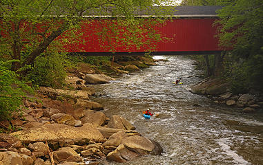 Covered bridge and kayakers