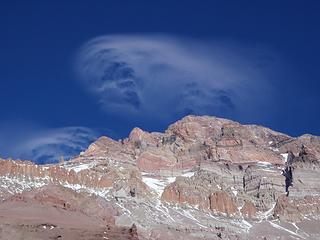 Lenticular Clouds Blowing Over The Summit