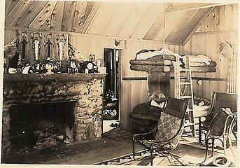Smith Place - Queets Valley - 1930s - view of northeast corner of Smith addition. Note peeled spruce log bunks hung with chains from ceiling, Navaho rug and wall hangings. photo courtesy S. Martinson