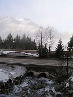 Light fog looking south across I-90 - creek (Wolfe?) flowing to Keechelus