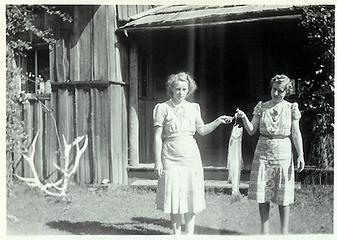 Smith Place - Queets Valley - ca. 1929 - two women holding fish in front of porch - photo courtesy L. Vaughan