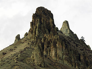 Saddle Rock from the South the prominent spire is called the "Cock".