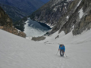 Aaron ascending towards the col with Colchuck Lake behind (Jake photo)