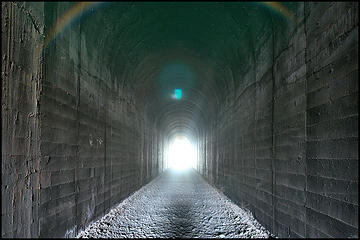 Nikkor 50-300mm f4.5 ED AIS. Taken in the middle of the quarter-mile Kahlotus tunnel with a very slow shutter speed. The end is still more than a football field away. A pretty good flare test!