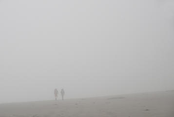 Hikers in fog on Third Beach