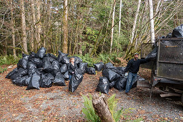 Friends of the Trail hauling bags of cabin debris to the dump