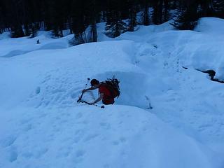 David climbing out of creek crossing