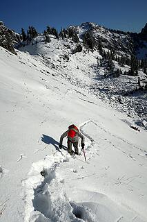 Kicking steps upward to the ridge crest