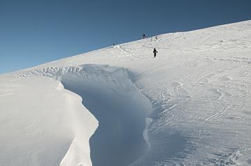 DSD_7786 - Tiny people approach giant wind carved snow channel