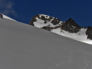 Adam and Heather snowshoe towards the ridge