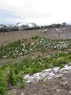 I find it interesting that the inner slope of the Metcalf moraine is covered with young trees, while the equivalent slope on the Railroad Grade moraine is not treed (the trees in the middle are on till covering a bedrock knob). The difference is probably due to warmer west-facing exposure on Metcalf moraine. Park Butte with its wonderful  lookout in the distance.