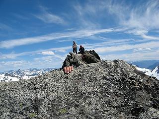 Yana's hand over the edge, with Greg & cartman on summit