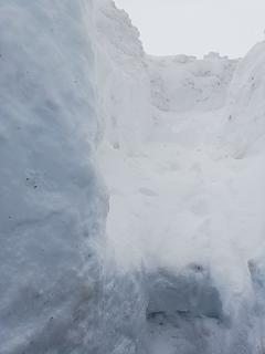 Exit staircase, we would fling snow up as many stairs as we could with people stationed every two stairs to continue the flow.