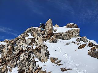 Downclimbing the summit block. Snowy class 3 in crampons.
