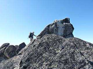 Climbing the summit block of Cannon