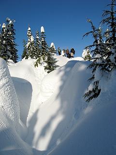 Arriving at the summit, past deeply trenched outcrops