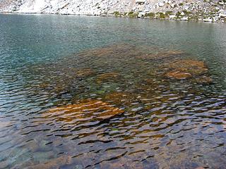 Red rocks in the water