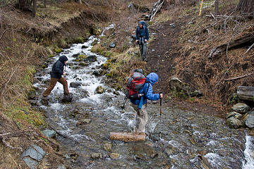 Hikers try to keep there feet dry while crossing McCrea Creek, West Fork Rapid River Trail, Idaho.