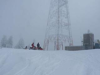 Snowmobile gathering at the tower