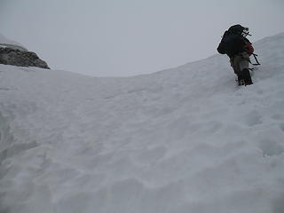 Descending steep snow on the N side of the Col.