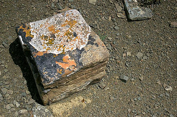 A perfectly square rock sitting on the ridge