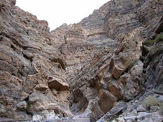 step up on the piled rocks.  Fall canyon, Death Valley Wilderness, CA