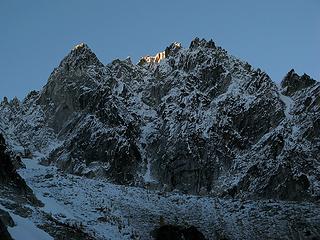 First light touches Colchuck Peak