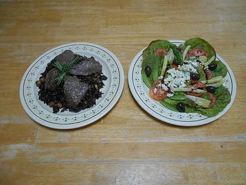 broiled venison medallions on wild rice with hazelnuts and ginger and salad made with Joe's fresh-picked red leaf lettuce, tomato, and yellow wax bean (and a couple other goodies.)