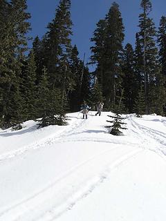 Jim K and David heading up into trees toward ridge line