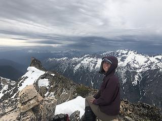 Summit shot with storms in the background.