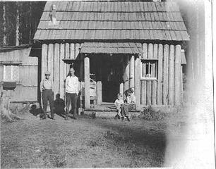 George Shaube homestead cabin Queets Valley - Alta (Northup) Shaube at left with son Lorne - 1923
