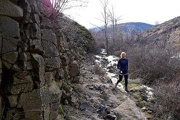 Rocky cliff and icy trail on the way back down