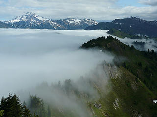 The cascade crest stops the clouds