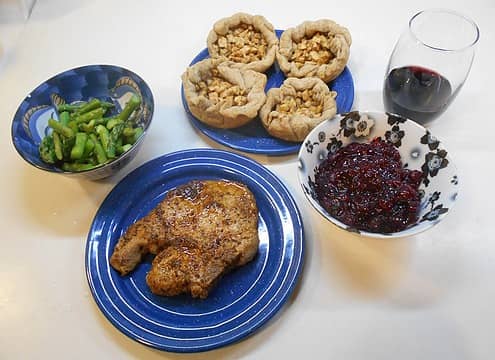pan-fried pork chop with cranberry sauce, steamed asparagus, and apple tart 11/30/22