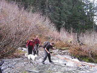 Mark, Joanna and Bob crossing creek with Holly