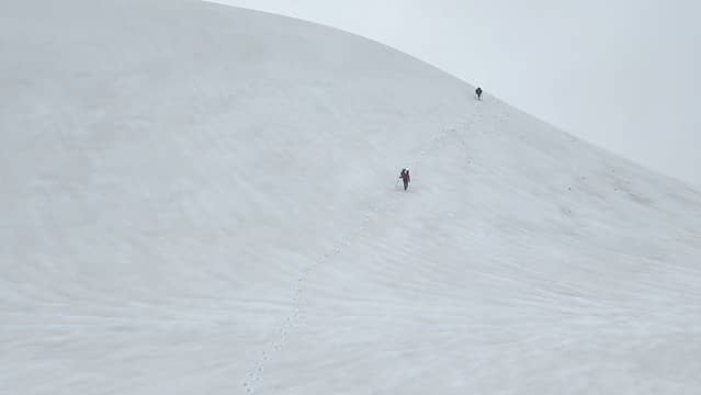 Traversing snow slopes on the ridge