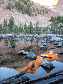 Morning reflection in tarn below Shellrock Pass where we camped