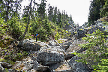 Angeline Lake outlet with massive rock blocks covering the water flow