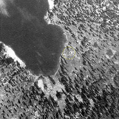 From a USFS aerial photo taken on 7/25/1942. It shows the Snow Lake cabin still in place with a path leading down to the lake shore.